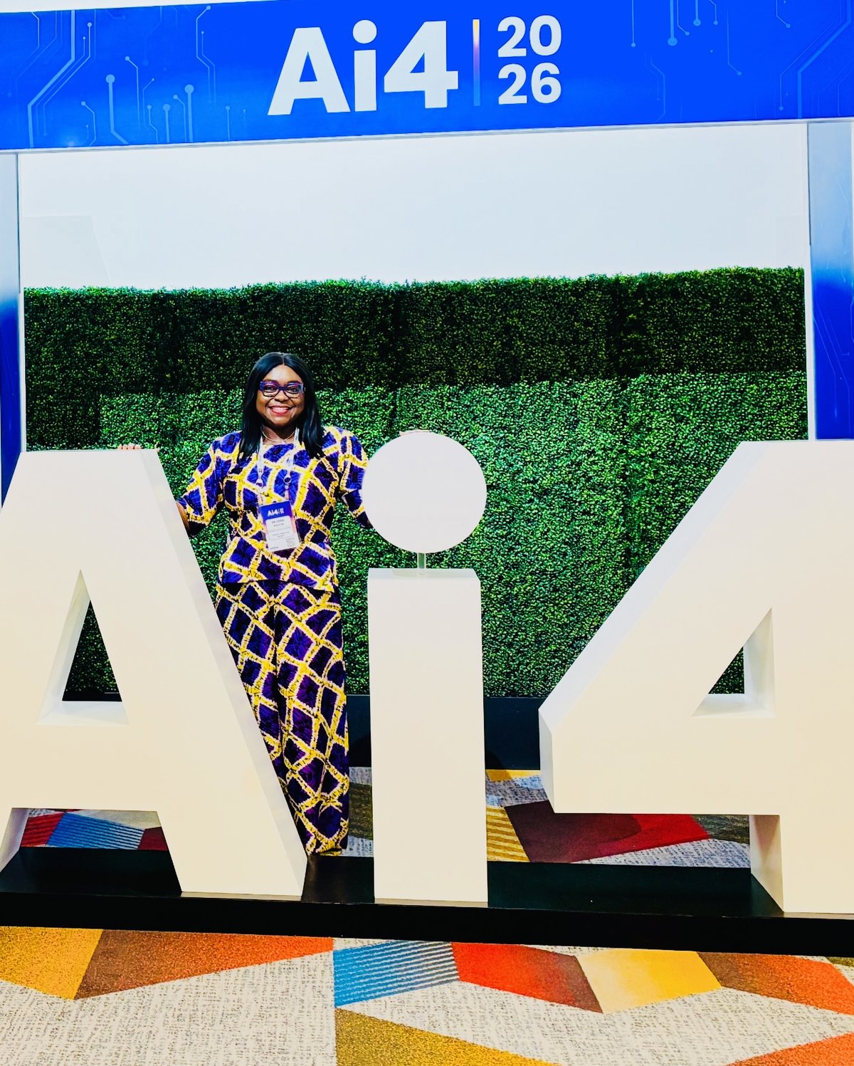 Belinda Enoma at the Ai4 2026 signage in Las Vegas